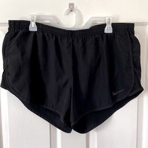 Nike brand athletic shorts with built in underwear, drawstring, pocket on back